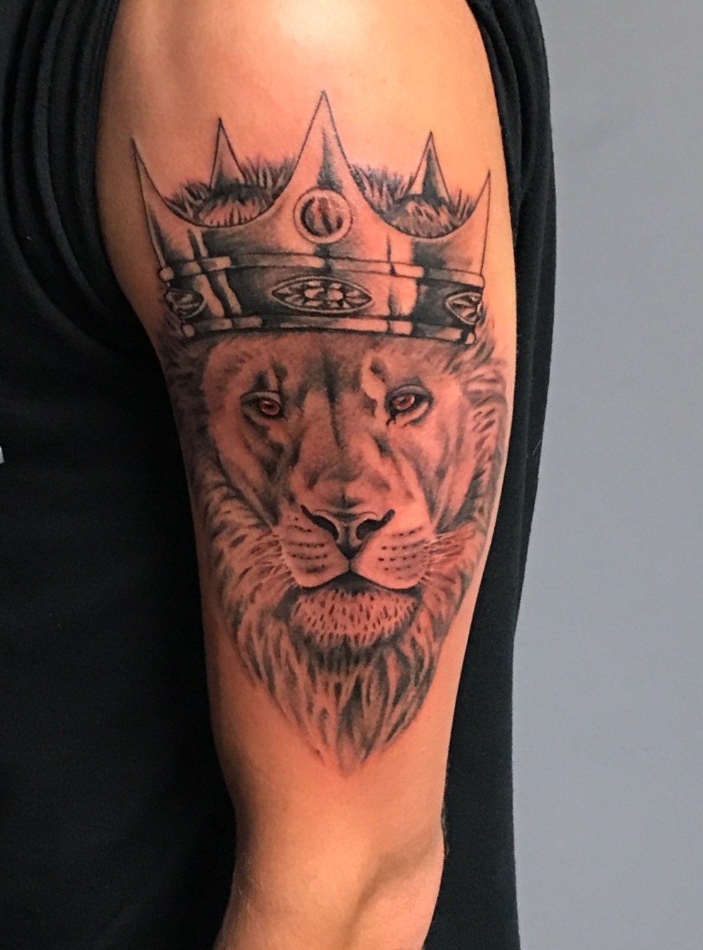 lion with crown tattoo, black and grey tattoo, crown tattoo, Johnny calico, tattoo artist Michigan
